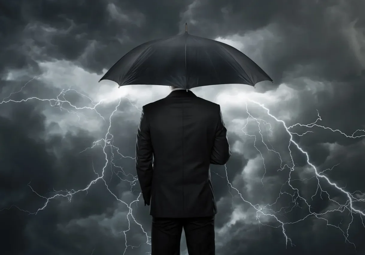 Businessman facing lightning storm