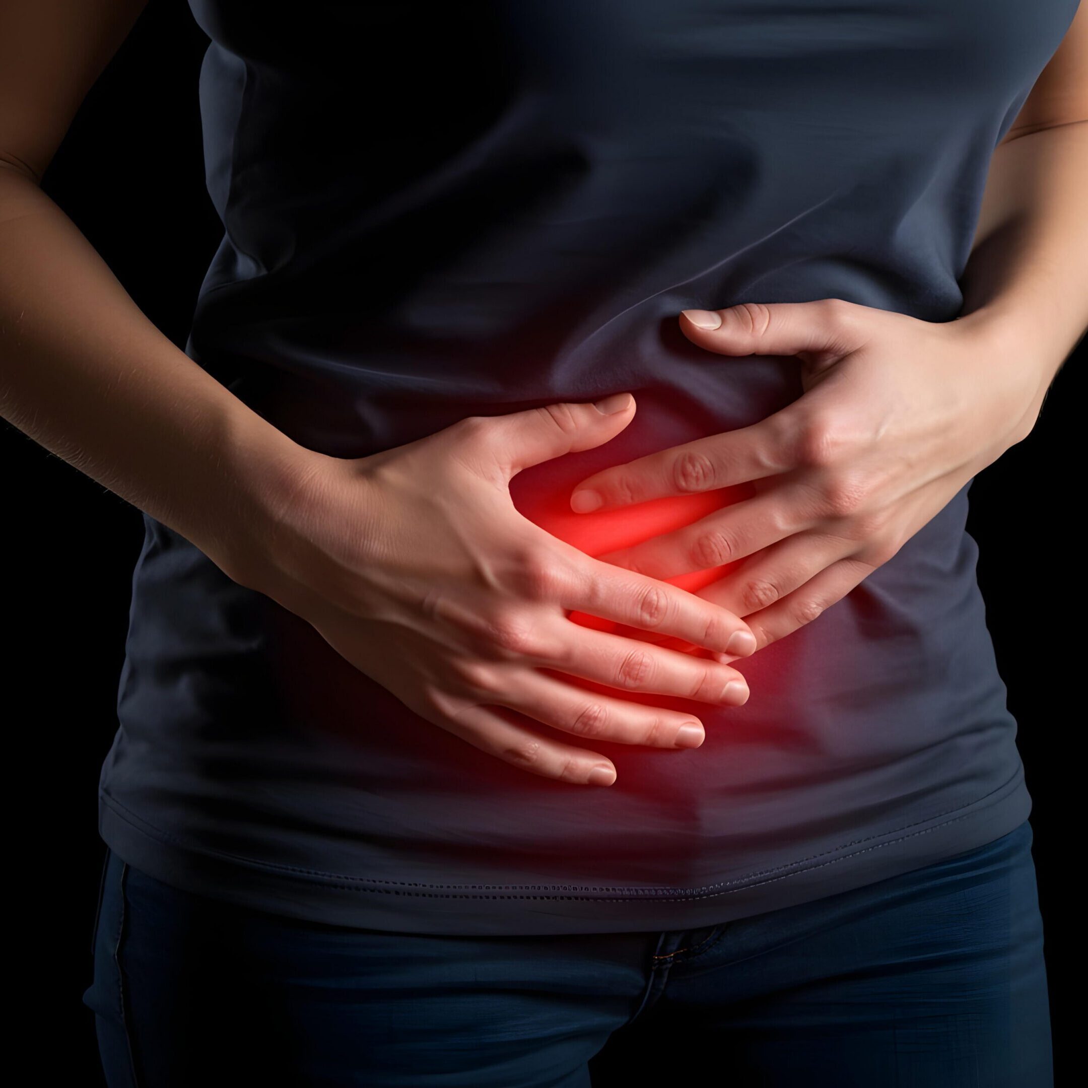Person holding stomach with pain indication.